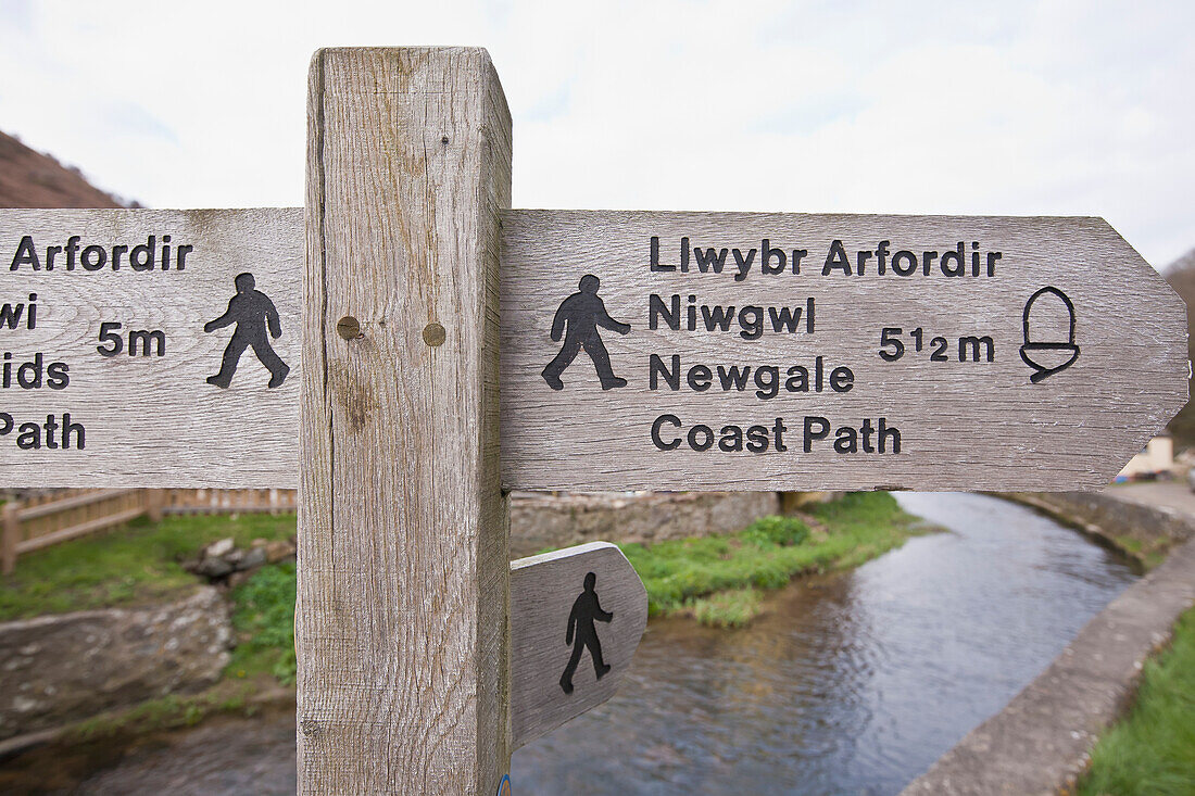 Wooden sign and post for Wales Coast Path; Wales