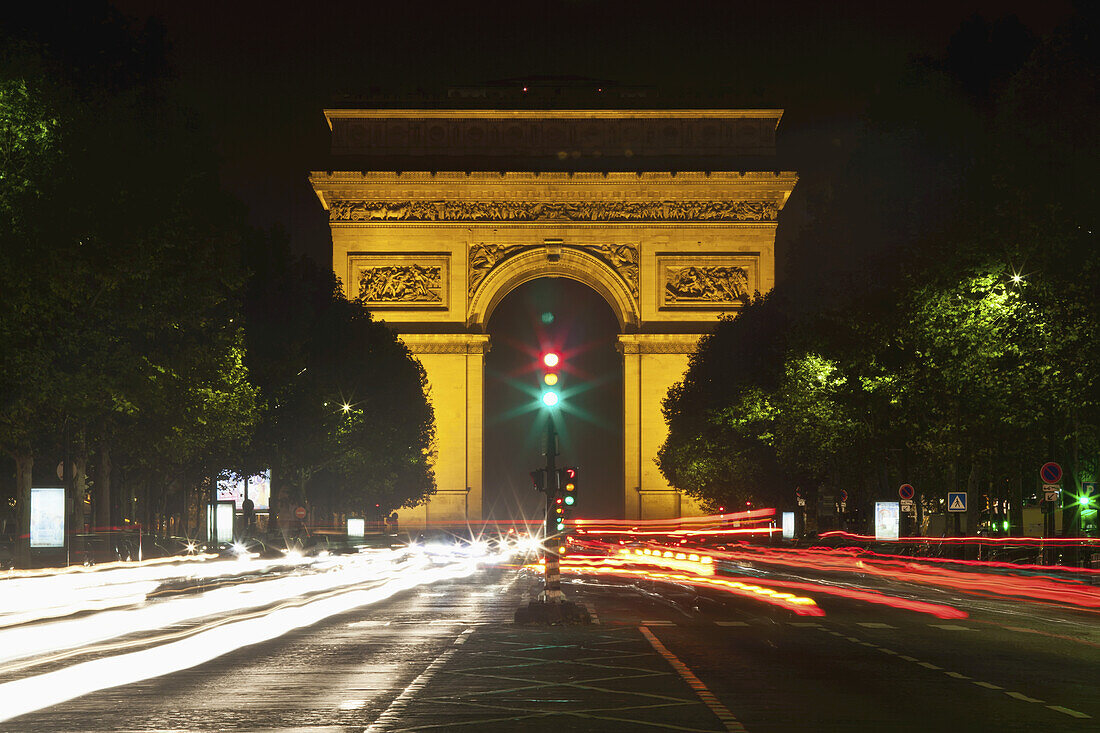 Arc De Triomphe At Nighttime; Paris, France
