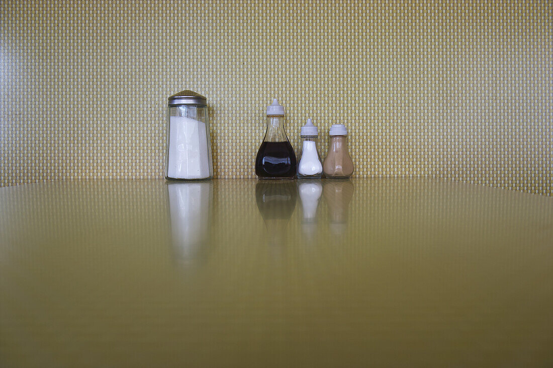 Condiments Lined Up On A Restaurant Table; London, England