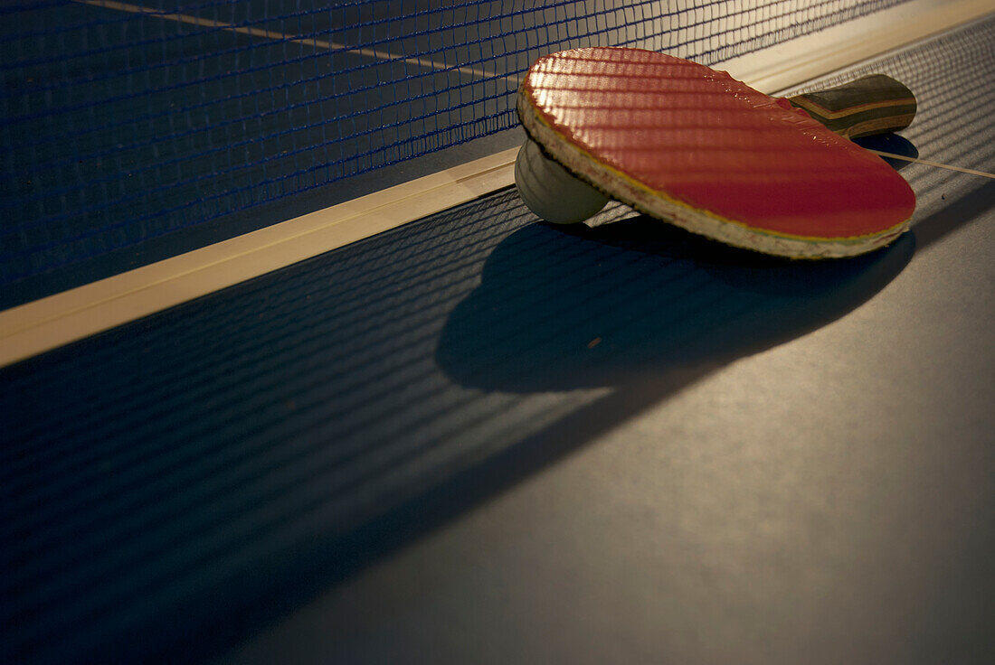 Ping Pong Paddle, Ball And Net On A Table; Tulum, Mexico