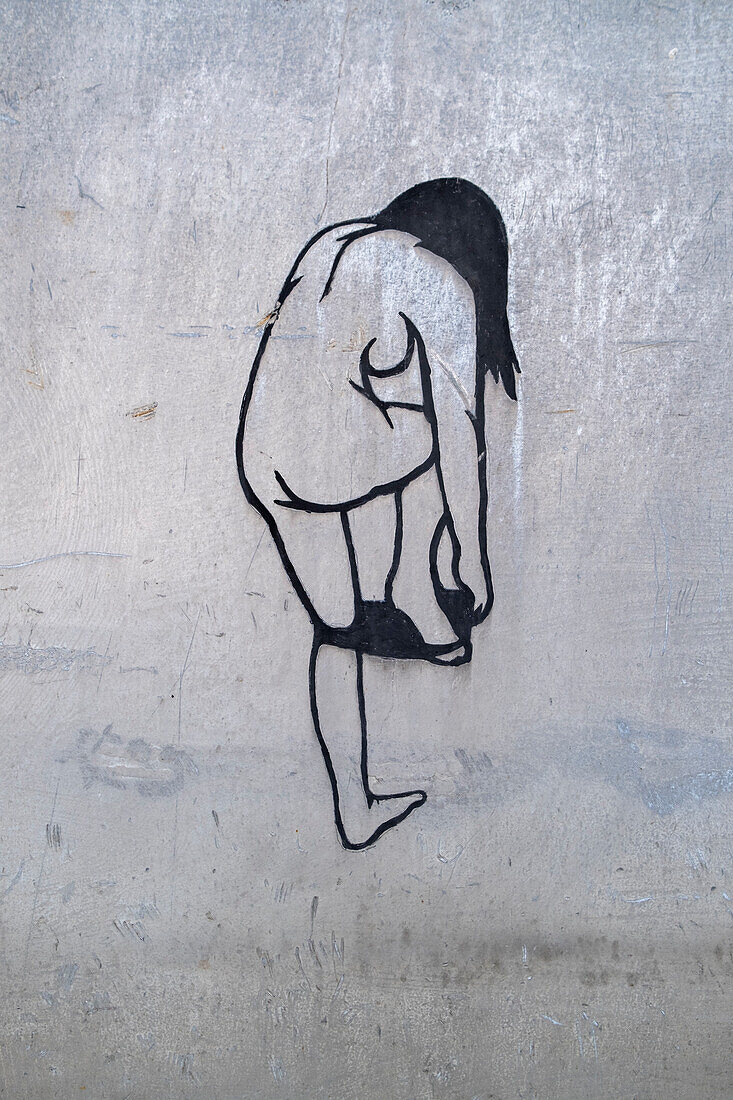 Female nude drawing on a metal wall