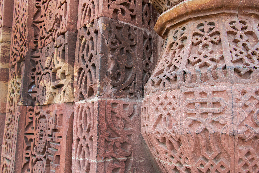India, Delhi. Qutub Minar, circa 1193, one of earliest known samples of Islamic architecture. Detail of ornate carved sandstone. UNESCO.