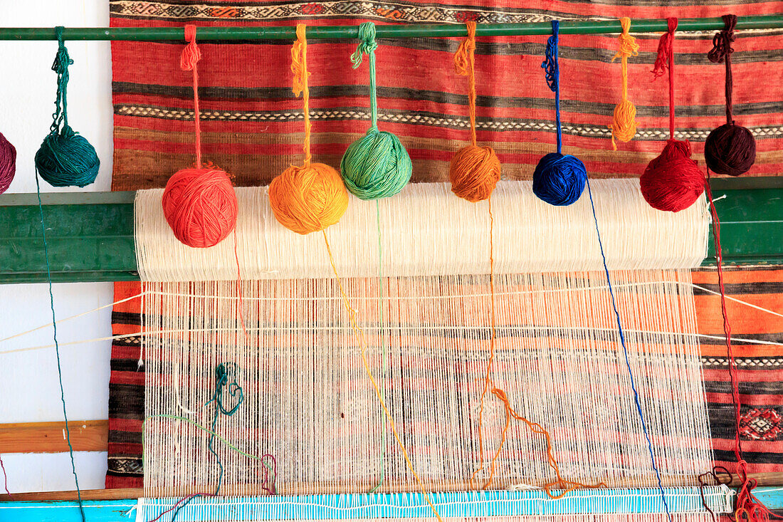 Turkey, Izmir Province, Selcuk, weaving loom, rug making, balls of wool or yarn.
