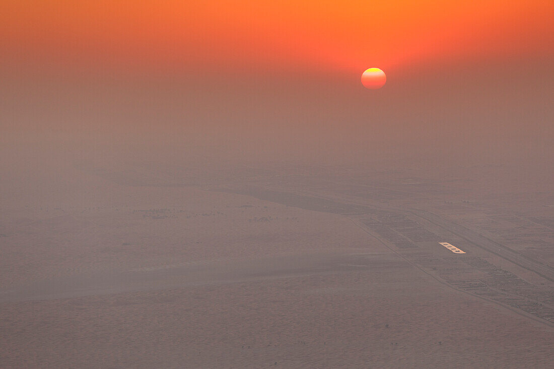 UAE, Al Ain. Jabel Hafeet, Al Ain's mountain, 1240 meters high, elevated view of sunset over The Empty Quarter