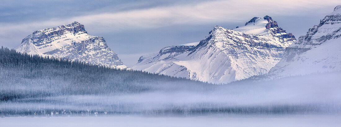 Canada, Alberta, Banff National Park, Panoramic view of Mount Andromache, Mount Hector, and Bow Lake with fog