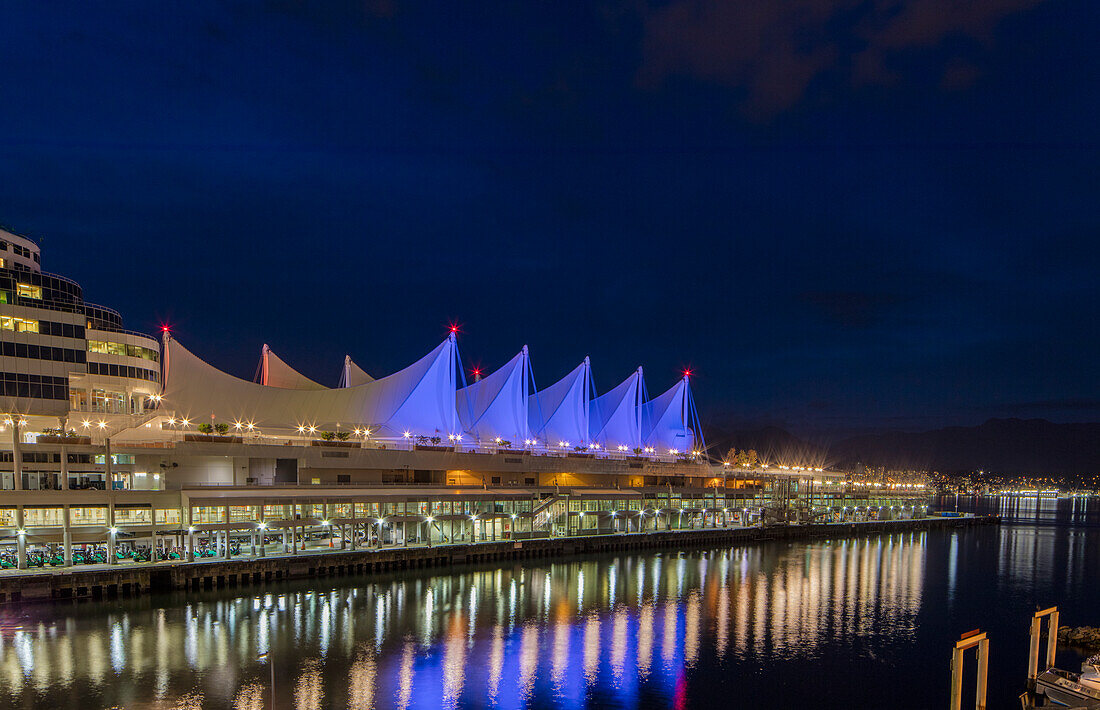 Canada Center lights reflect in harbor in Vancouver, British Columbia, Canada