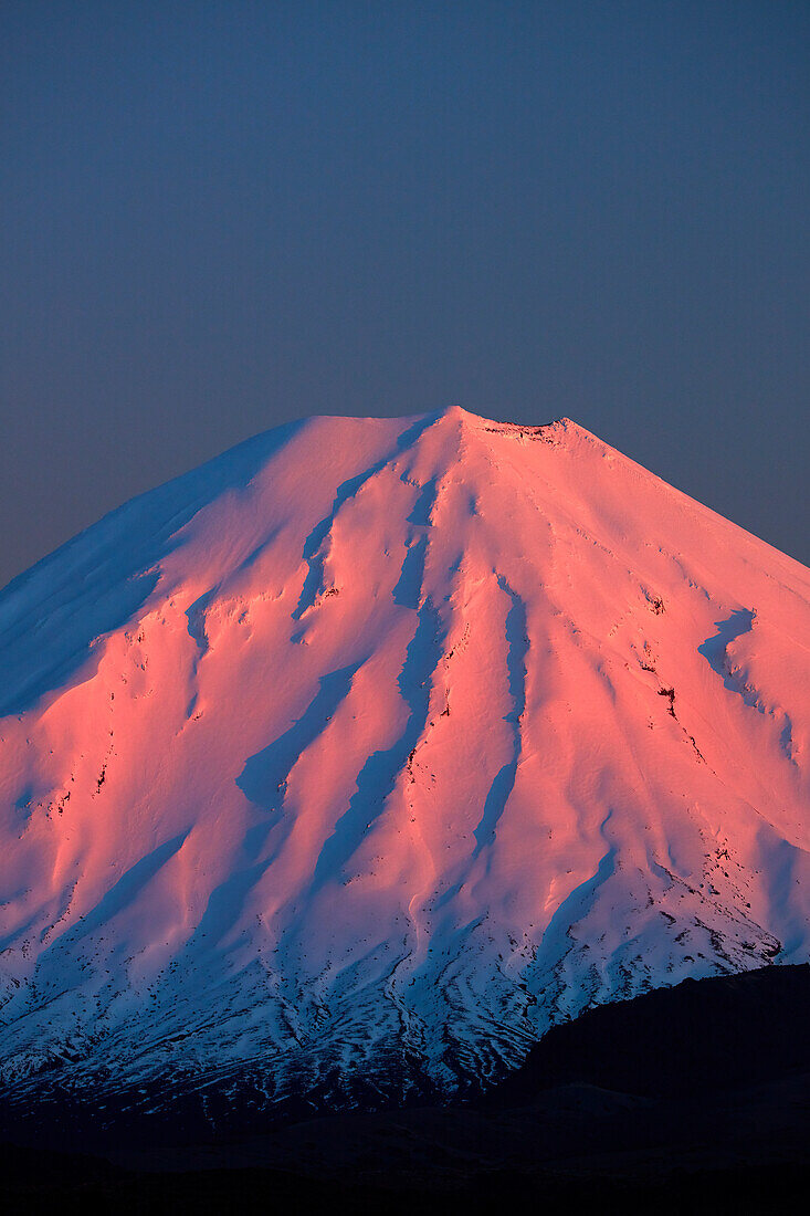 Alpenglow on Mt. Ngauruhoe at dawn, Tongariro National Park, Central Plateau, North Island, New Zealand