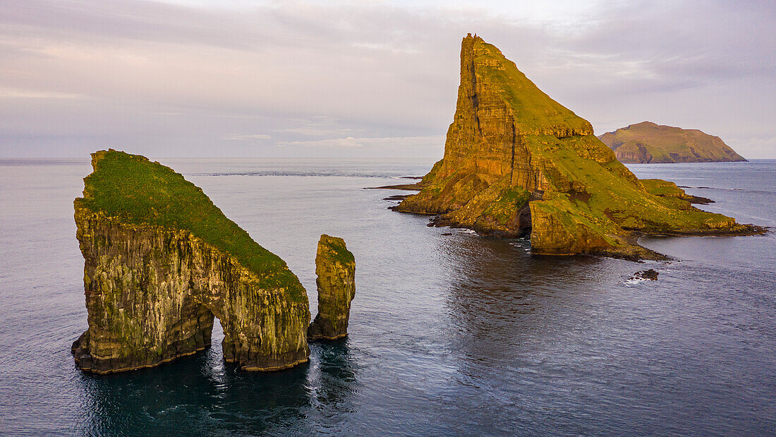 Europe, Faroe Islands. Aerial view of Drangarnir and Tindholmur off the coast of the island of Vagar.