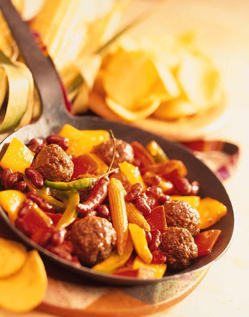 Pan-cooked meatball dish with peppers, baby corn & chili 