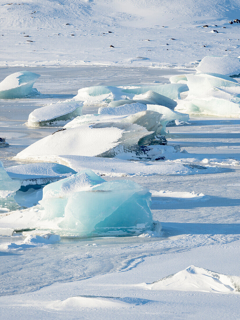 Frozen glacial lake Fjallsarlon in Vatnajokull National Park during winter. Iceland.