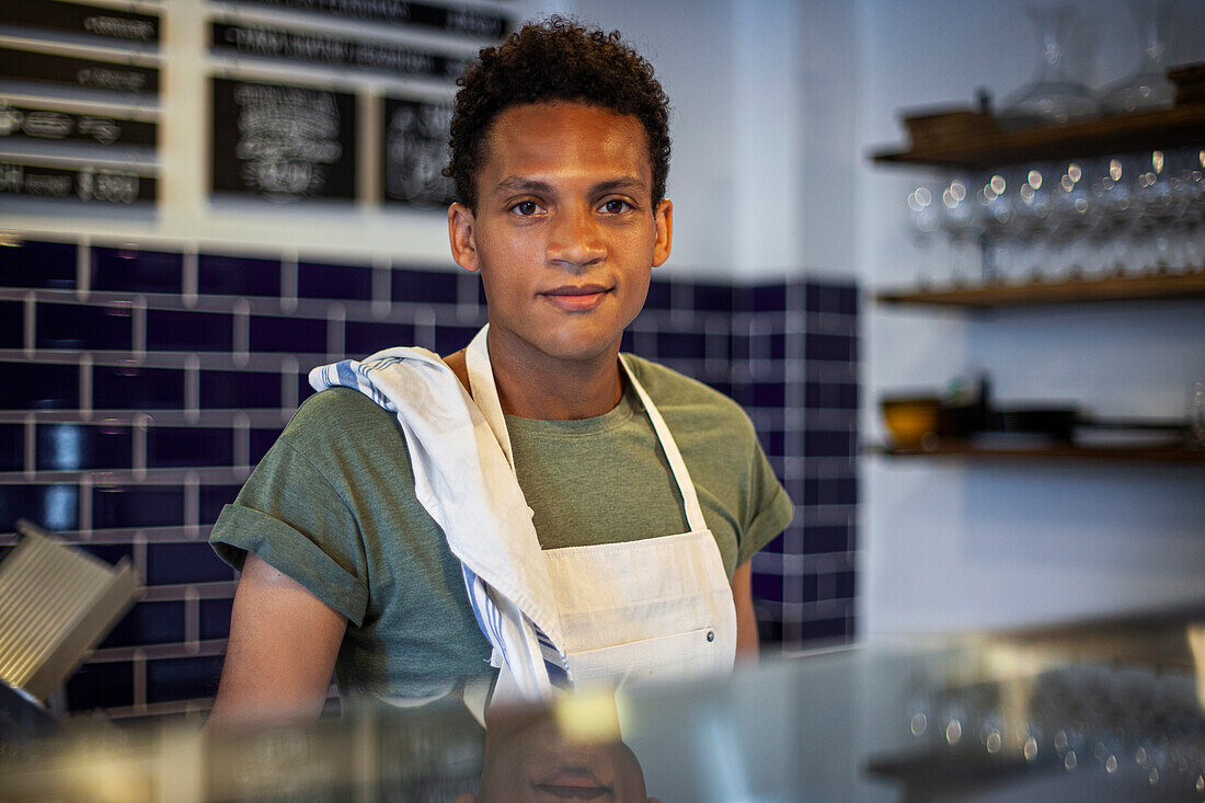 Latin American grocery store worker looking at the camera