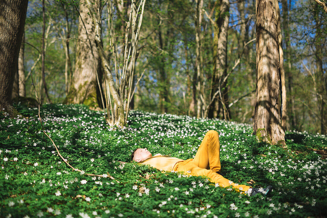 Woman relaxing in forest