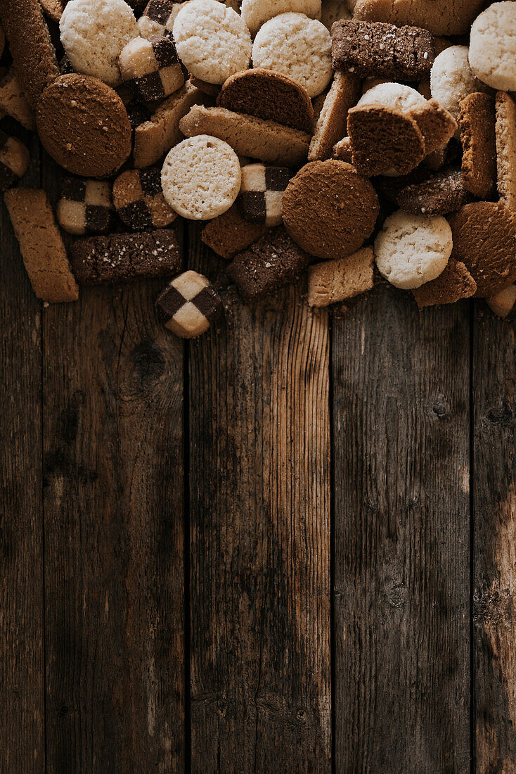 Various biscuits on wooden background