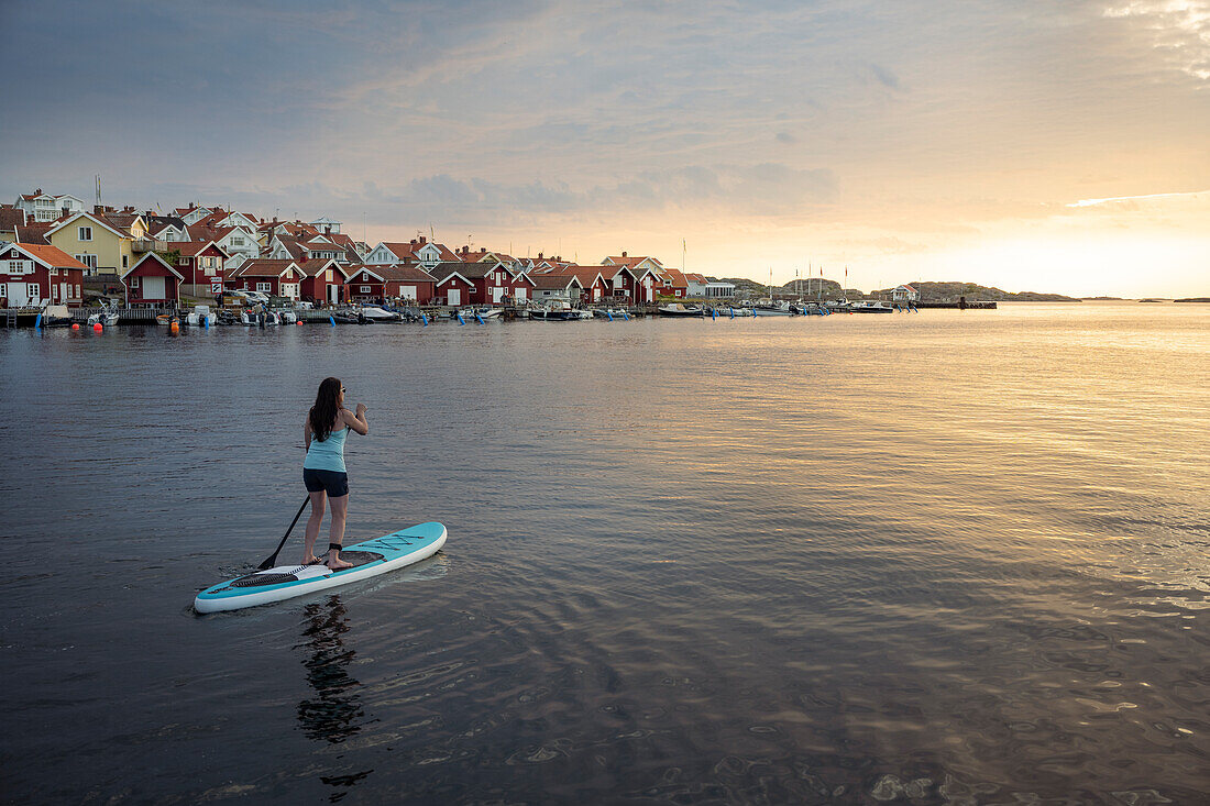 Woman paddleboarding at sea