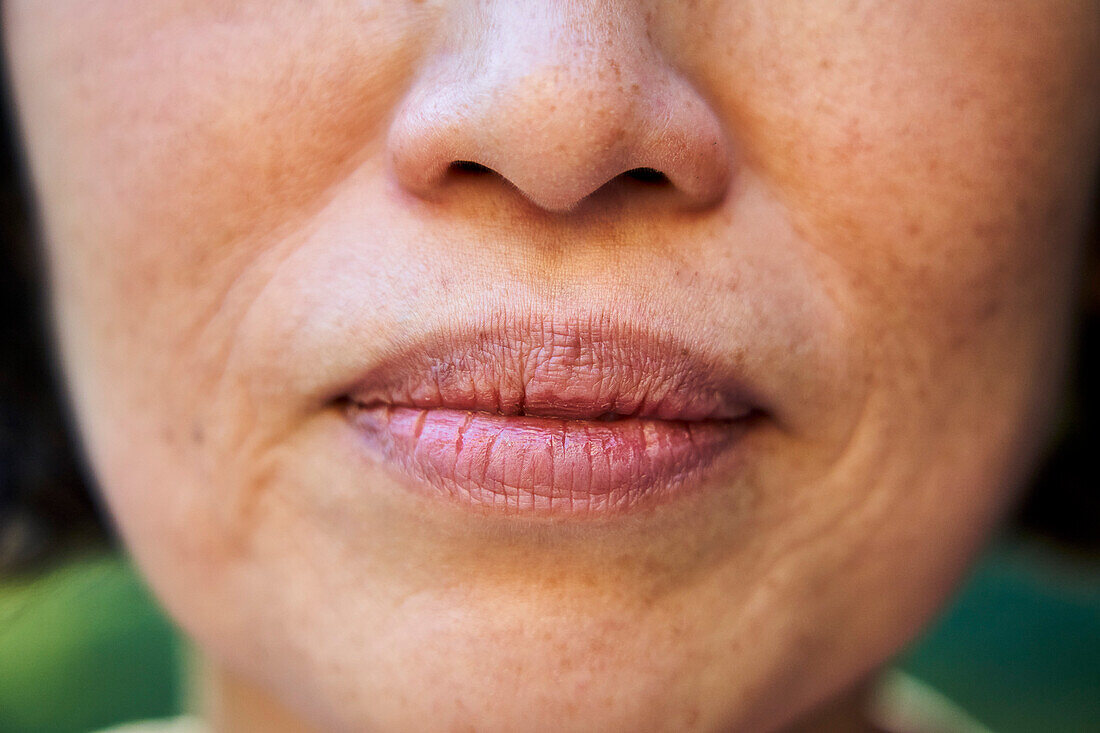 Close up of senior Asian woman's mouth