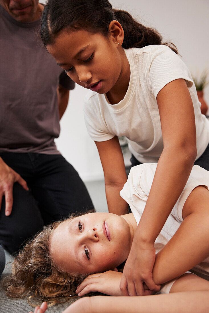 Teacher giving first aid training