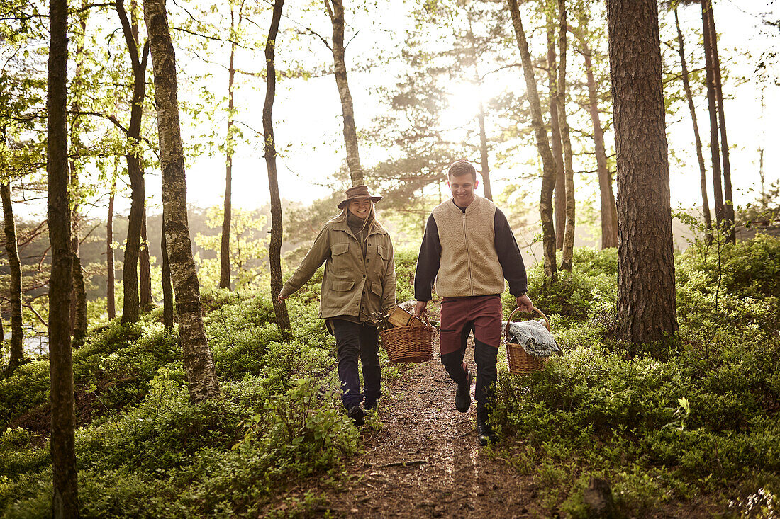 Couple walking through forest