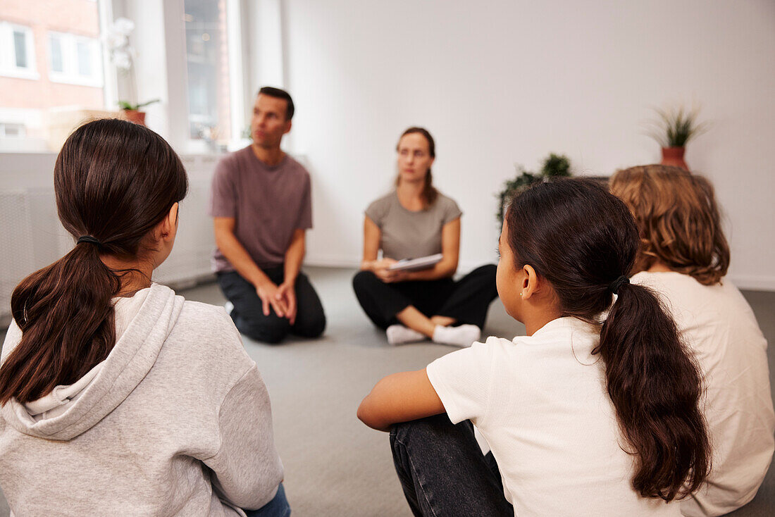 Teachers and children in class