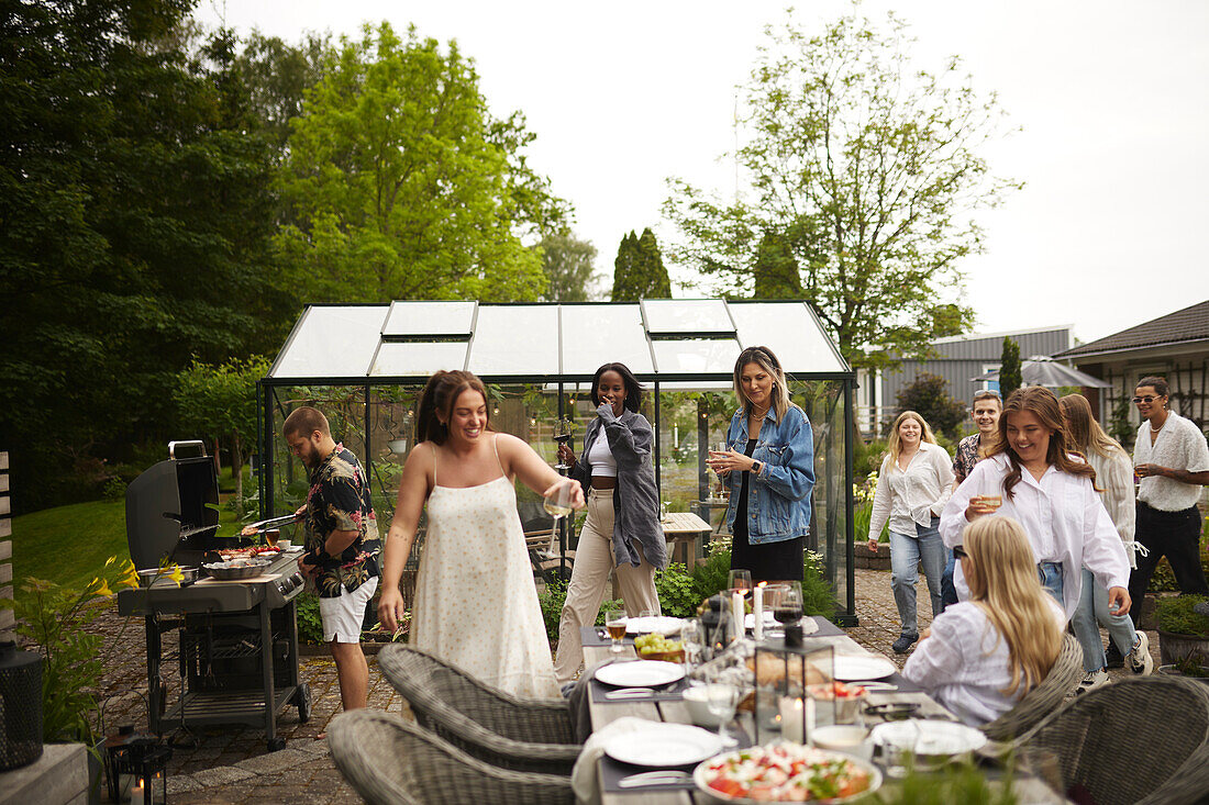 Friends having meal in garden