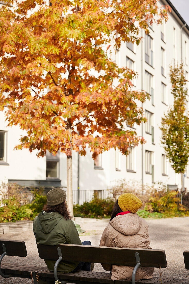 Man and woman sitting on bench