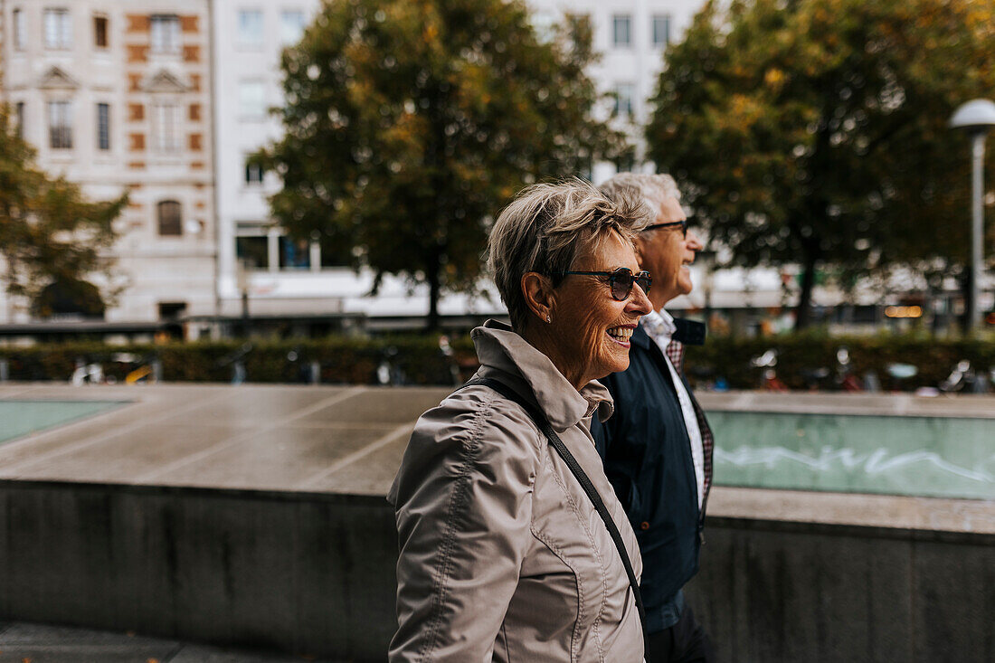 Senior couple walking in city