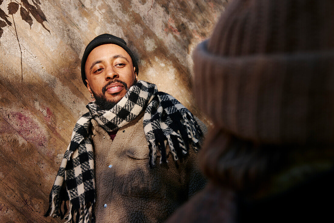 Man wearing scarf looking away