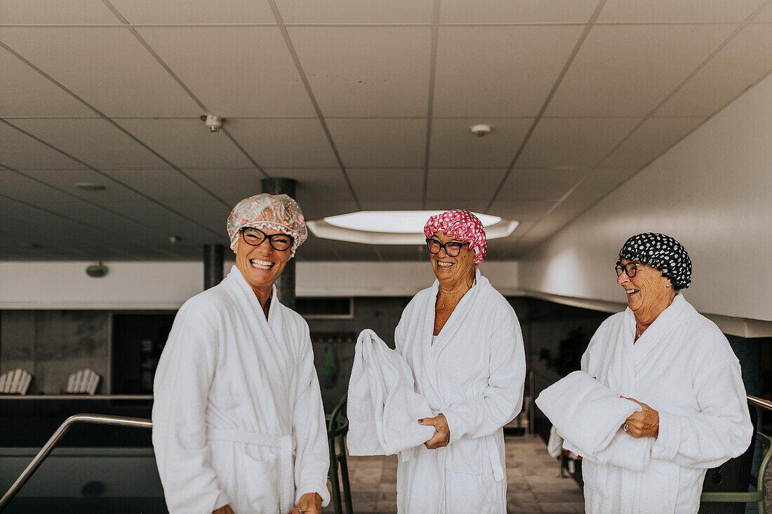 Happy female friends in spa