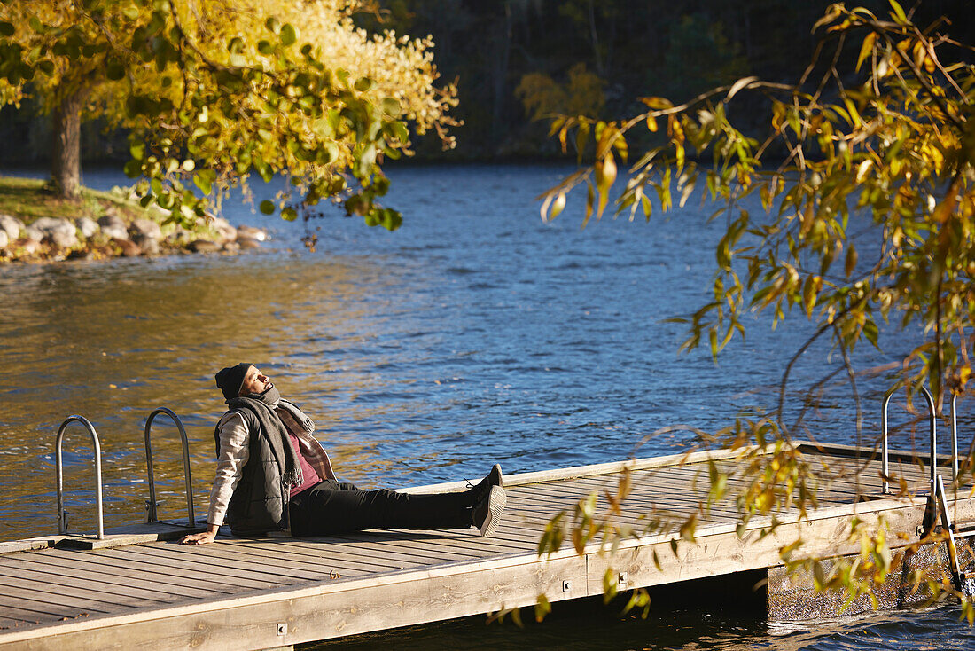 Man relaxing on jetty