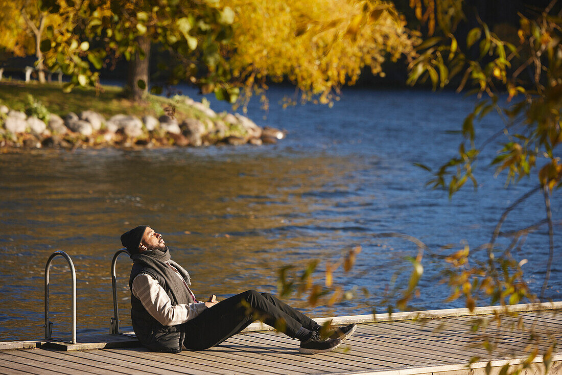 Man relaxing on jetty