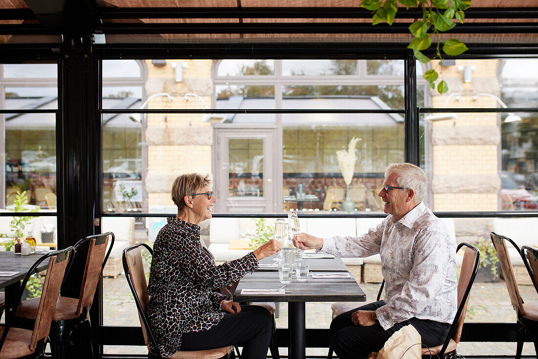 Mature couple sitting in restaurant