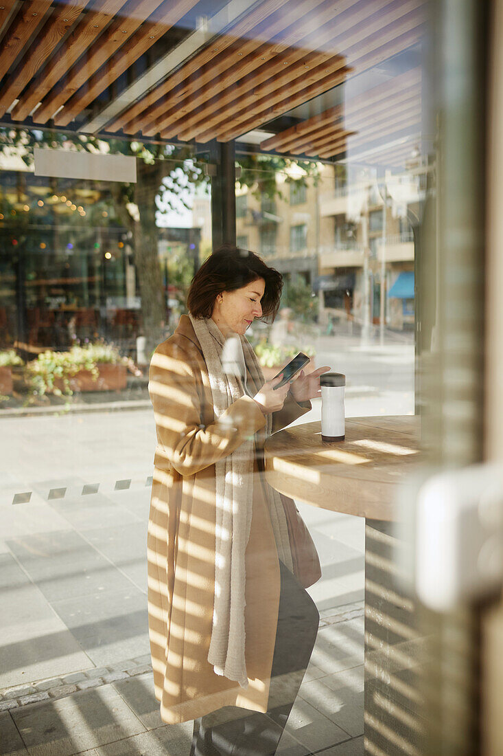 Businesswoman using cell phone