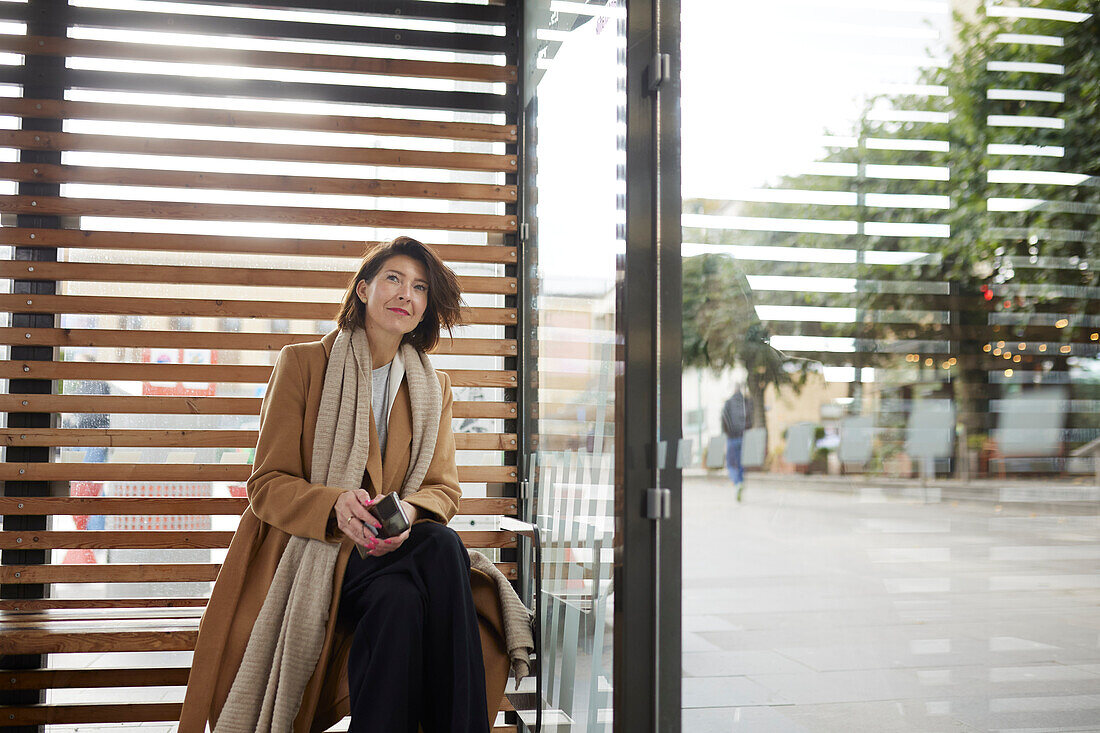 Smiling businesswoman looking away