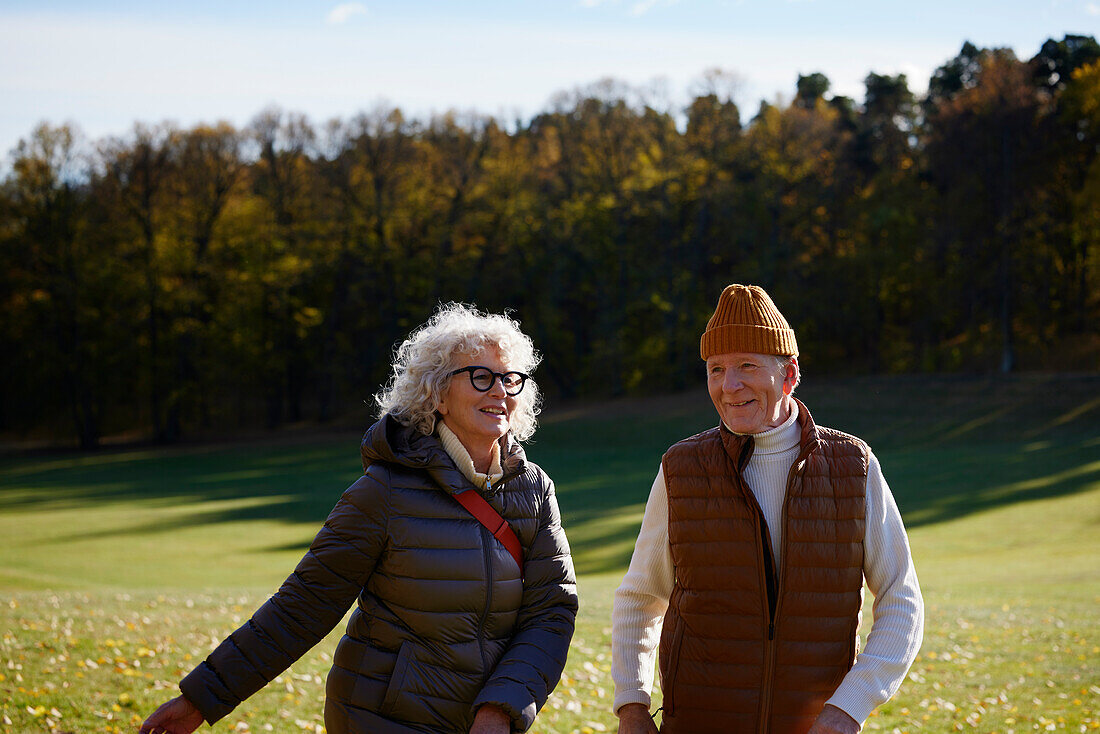 Senior couple in autumn scenery