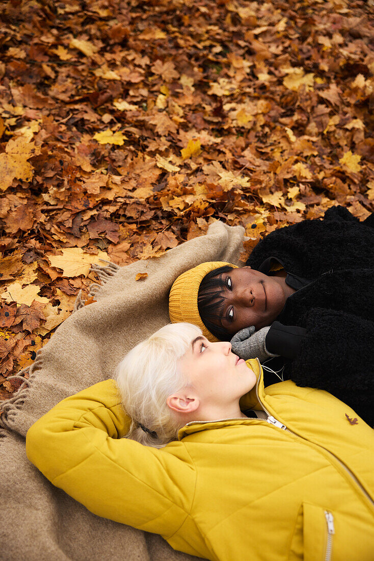 Female friends lying together