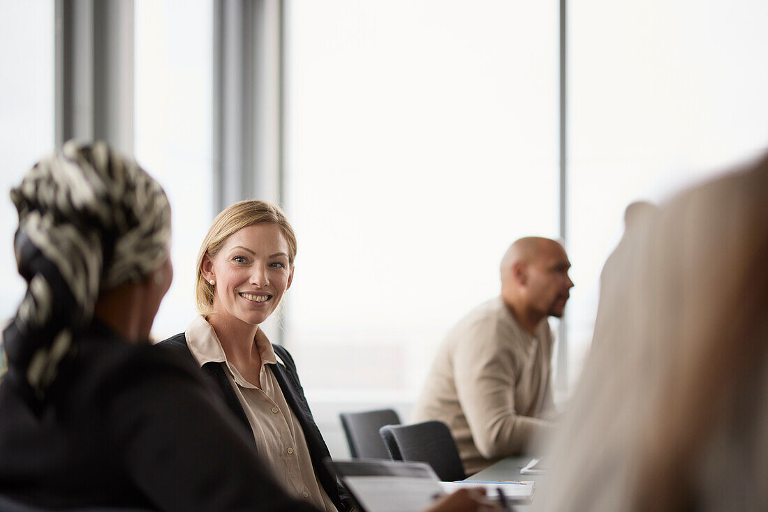 Smiling businesswoman at business meeting