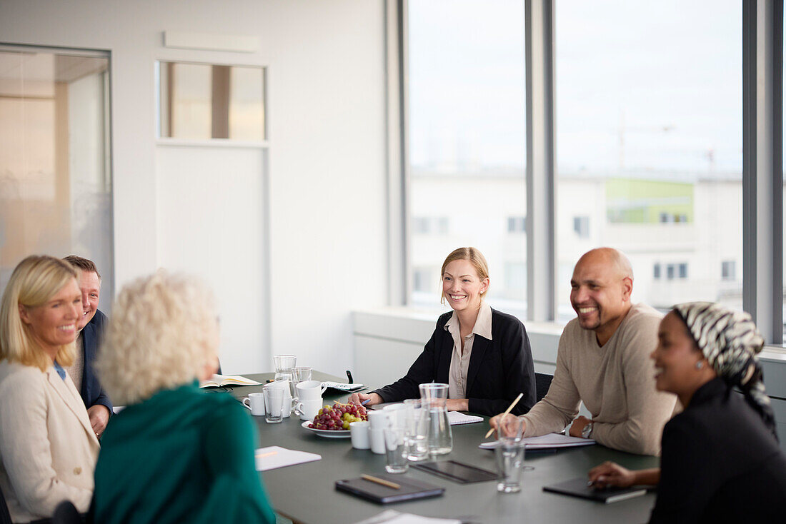 Smiling people at business meeting