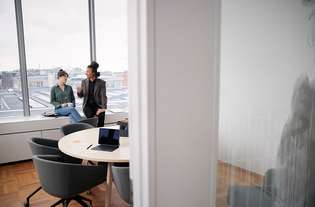 Business people having coffee break in office