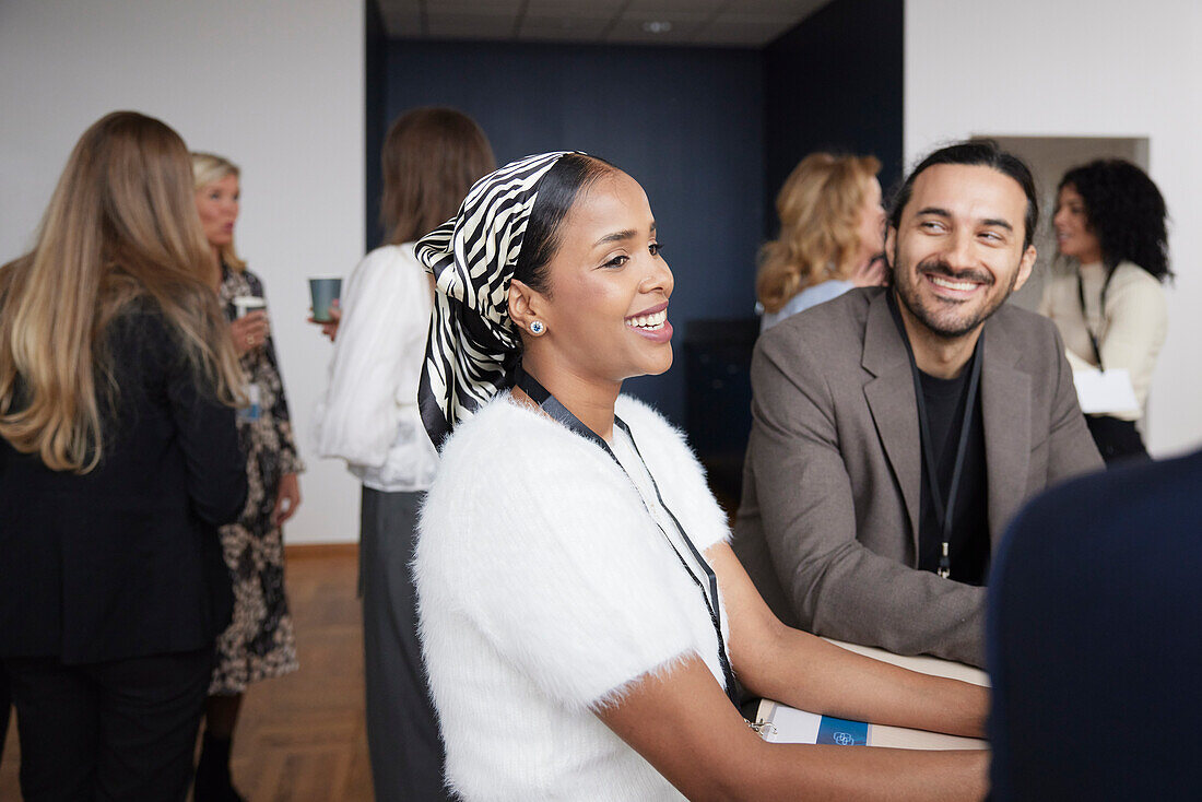 Smiling business people talking