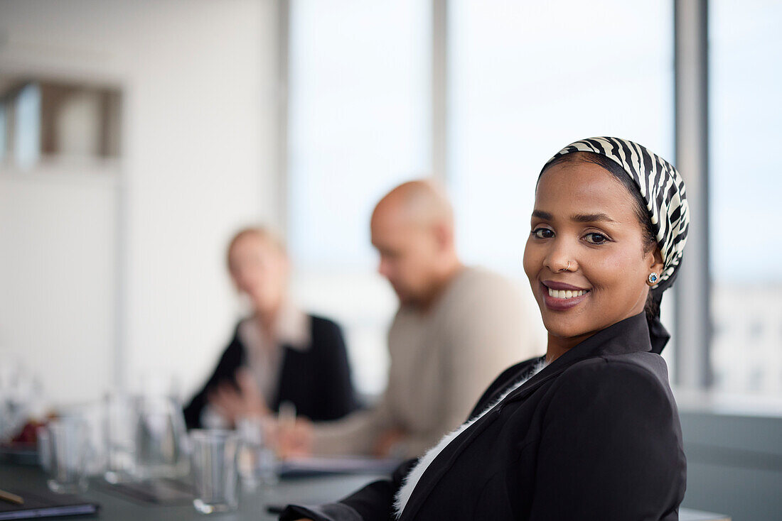 Smiling woman at business meeting