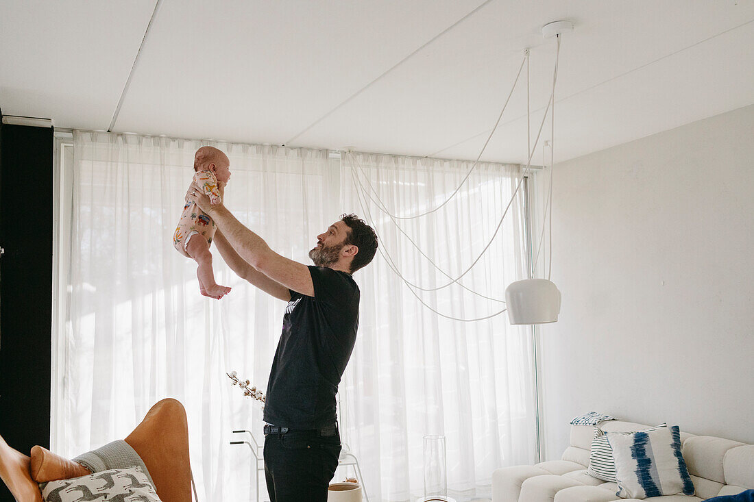 Father playing with baby