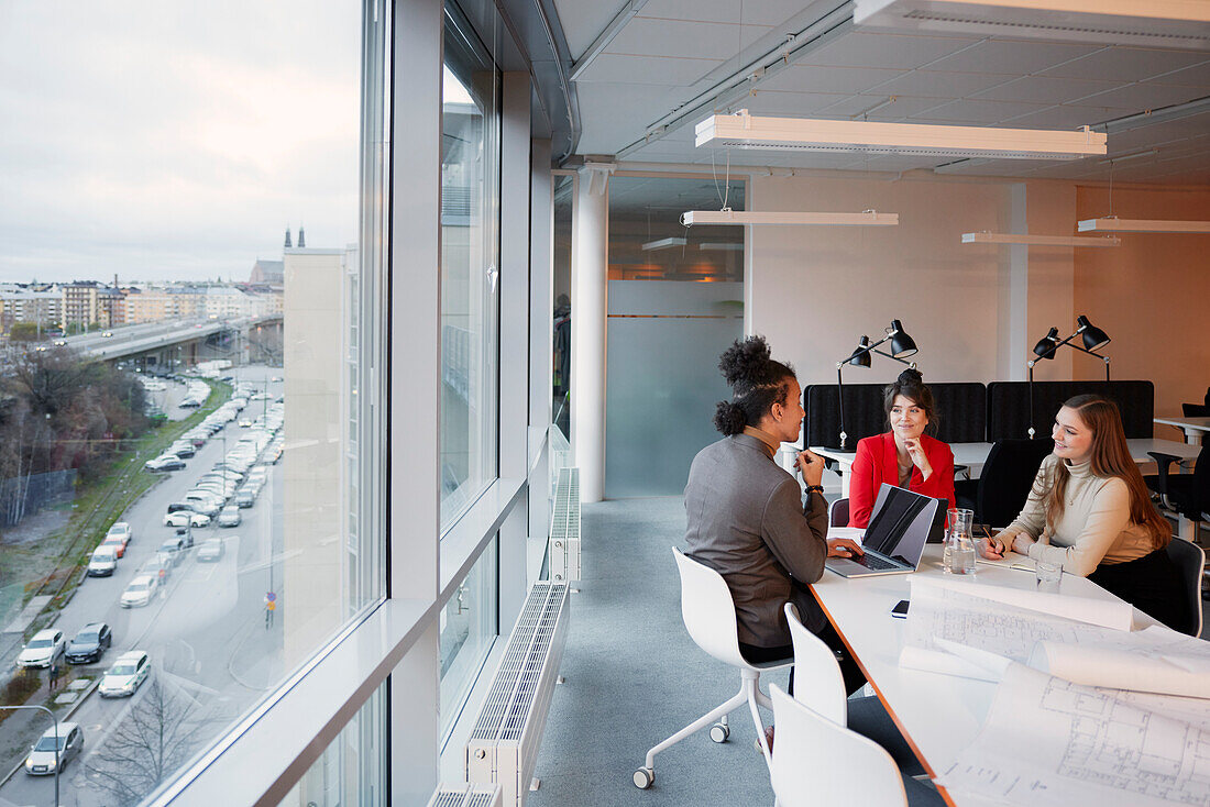 People having meeting in office