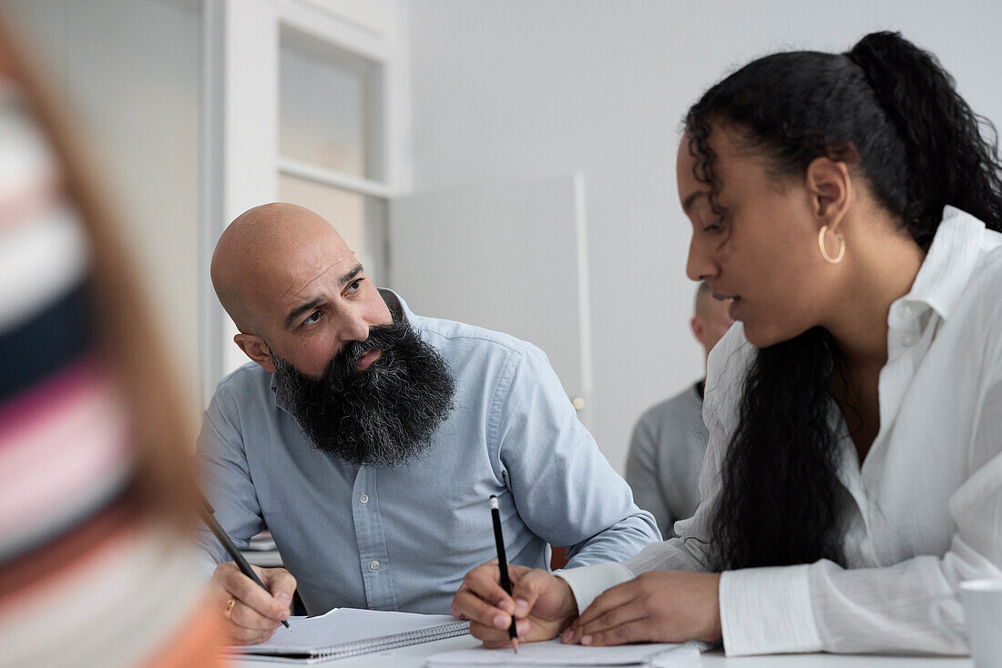 Adult students sitting in class