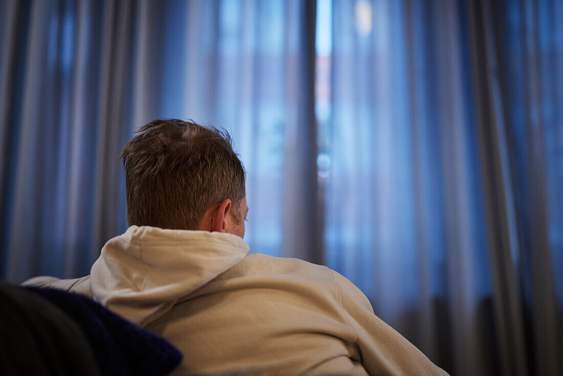 Man resting on sofa