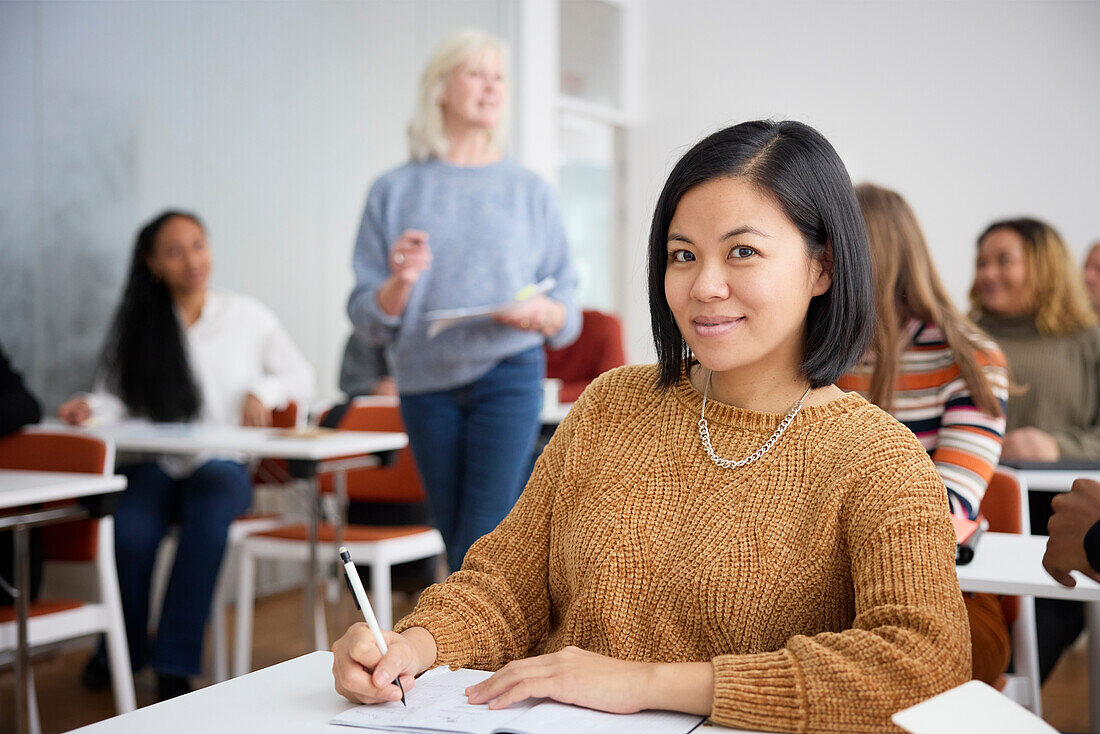 Portrait of smiling woman in class