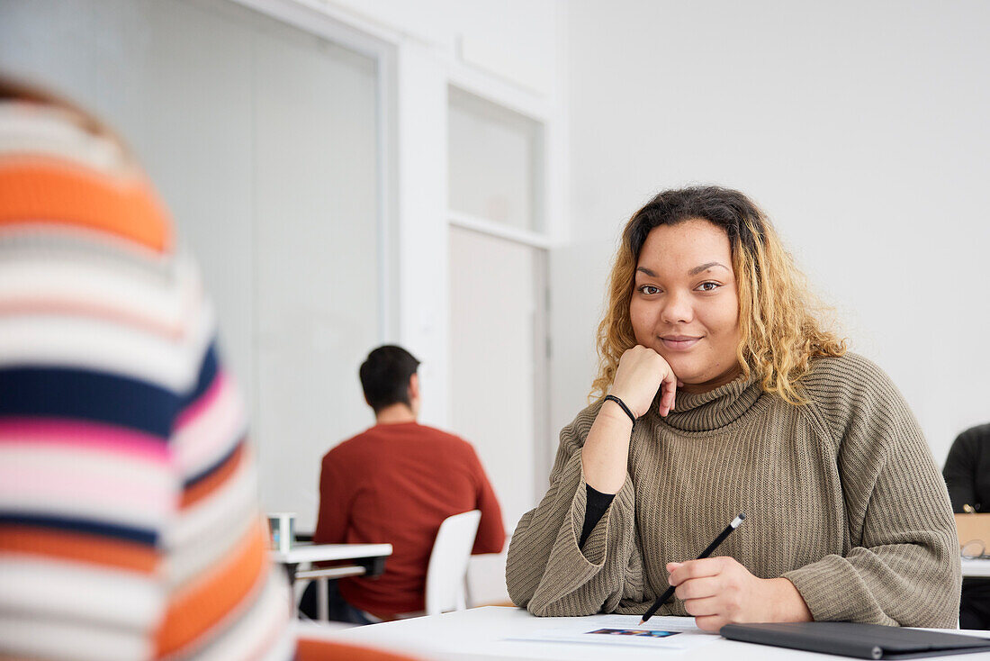 Portrait of smiling woman in class