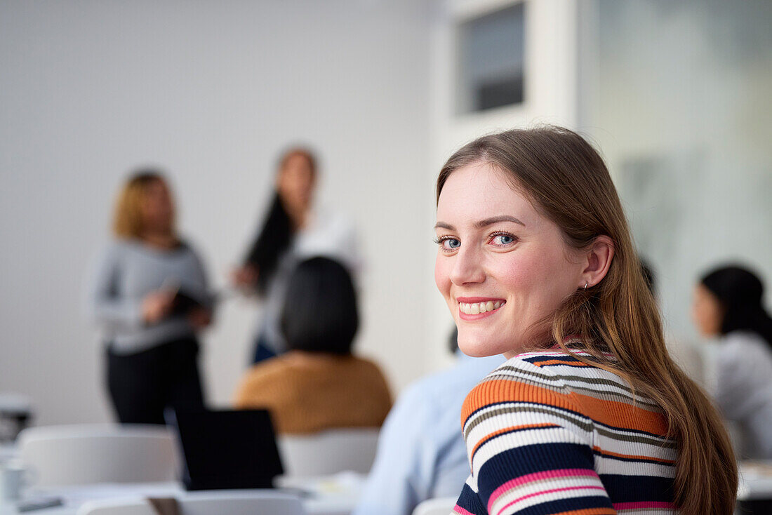 Portrait of smiling woman in class