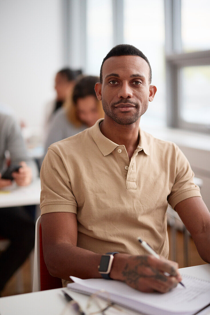 Portrait of mid adult man in class