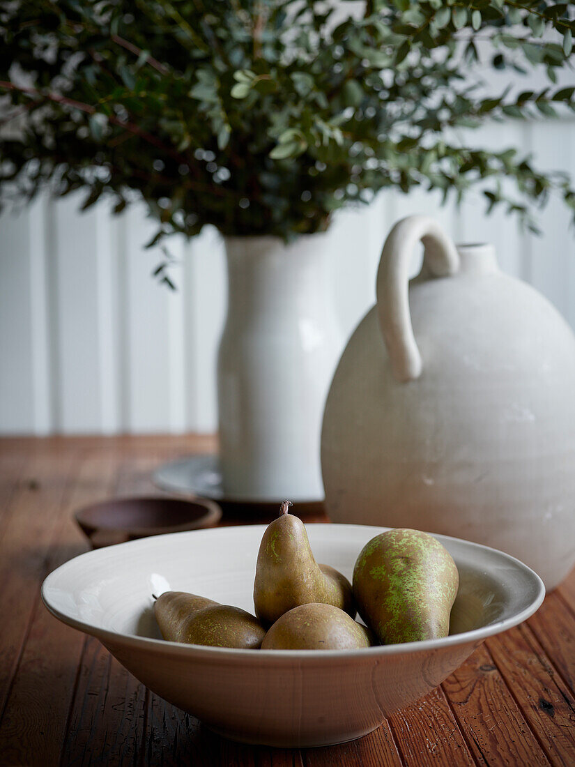 Pears in bowl on table