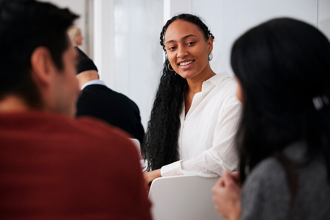 Smiling woman sitting at workshop