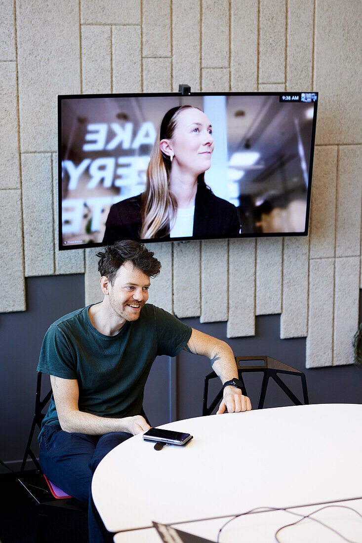 Smiling man at business meeting